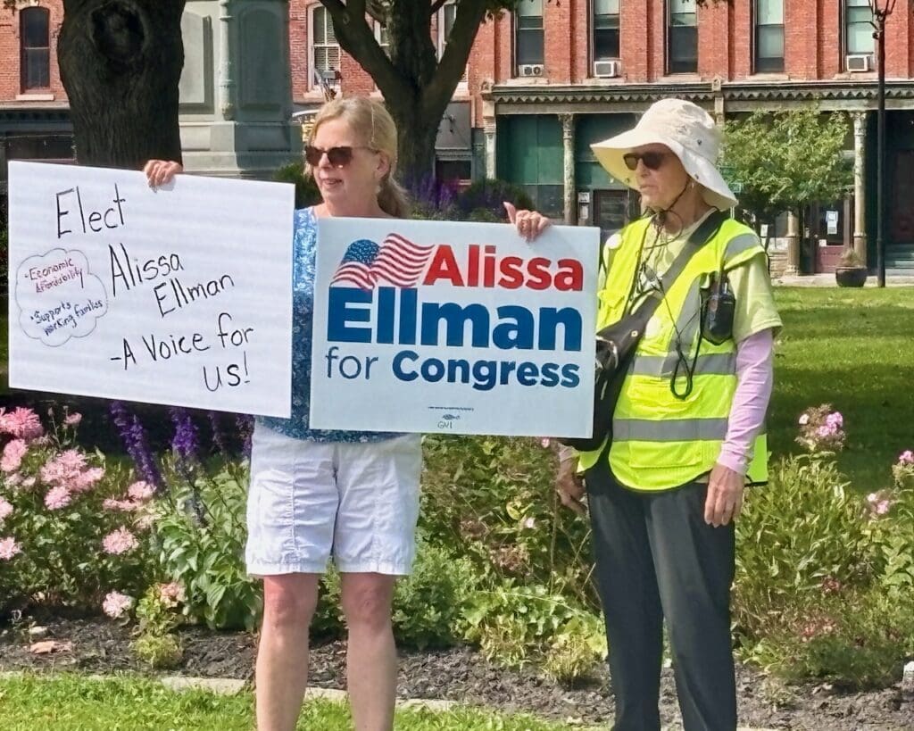 Two women holding Alissa Ellman for Congress campaign signs